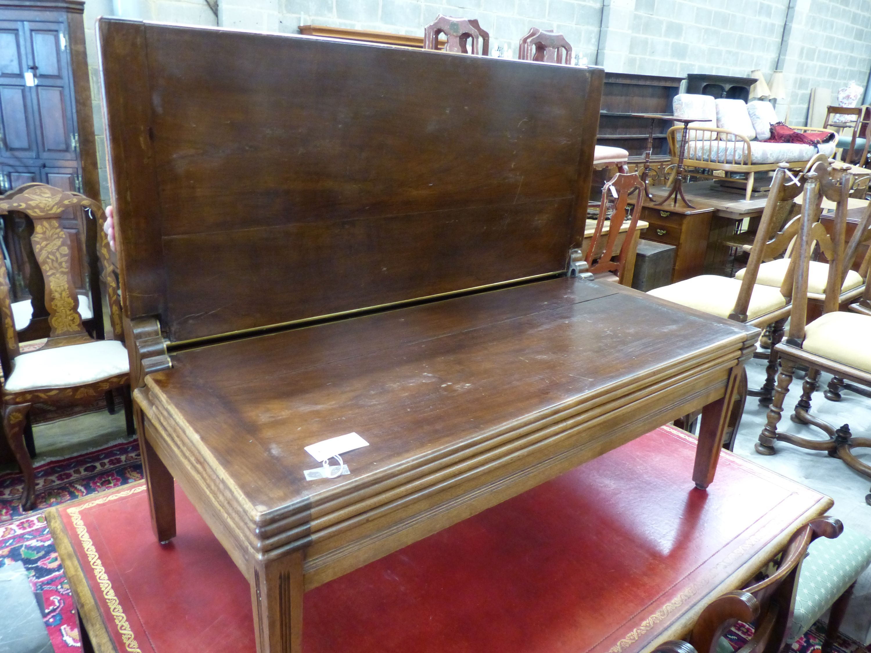 A mahogany trouser press-cum-bench seat, circa 1900, height 45cm, width 106cm, depth 54cm